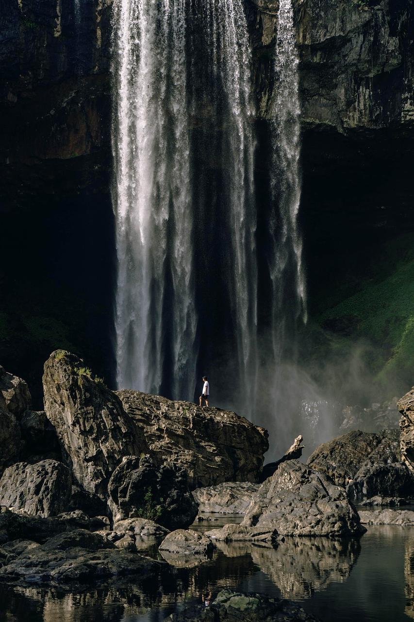 Hiker standing on the Cliffs of Moher